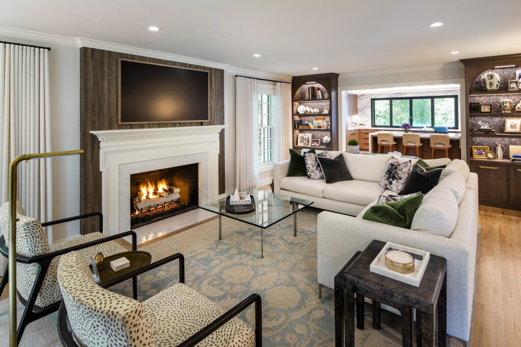 Open concept living room featuring a cozy fireplace, modern furnishings, and spacious layout