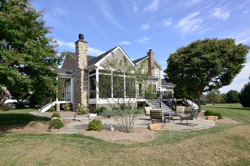 Expanded Northern Virginia home with new screen porch, deck, and enlarged family room and kitchen designed for summer outdoor living by Alair Homes Hunt Country