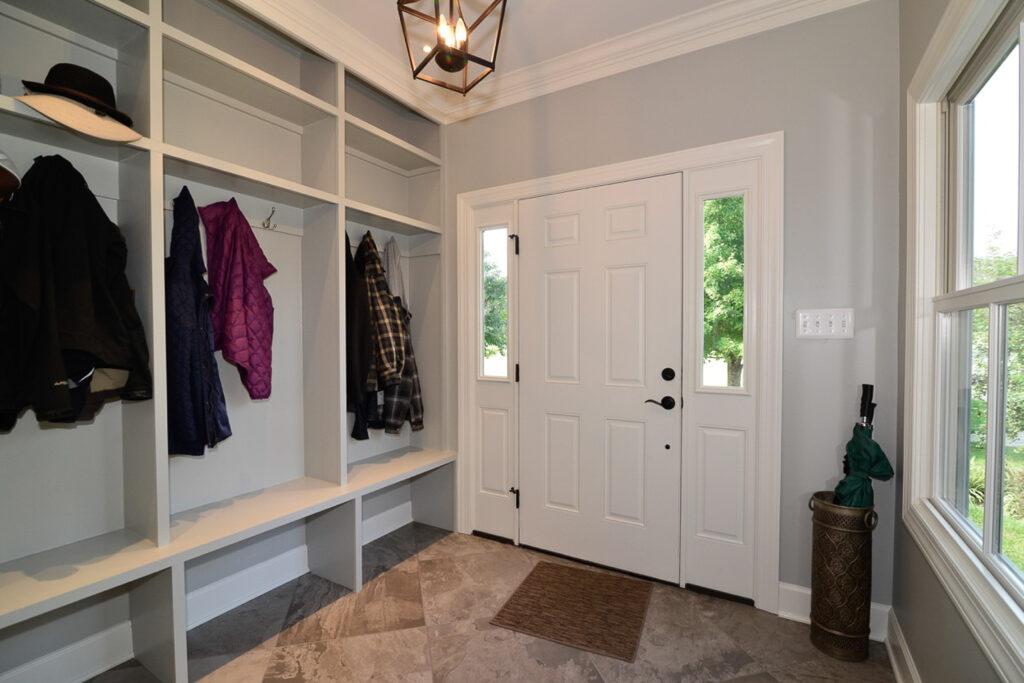 Side entrance with open storage and benches for organized storage