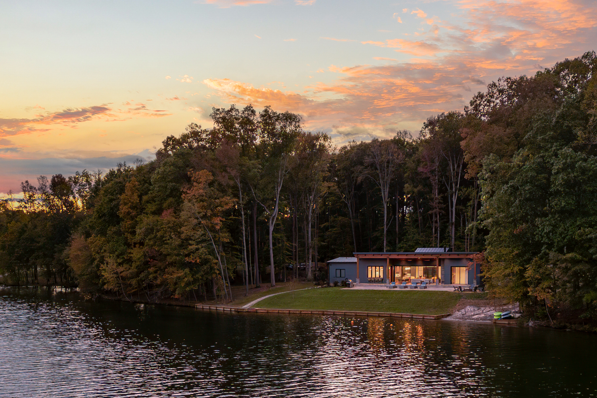 Completed modern custom home at Lake Anna with waterfront views and outdoor living spaces by Alair Homes Hunt Country