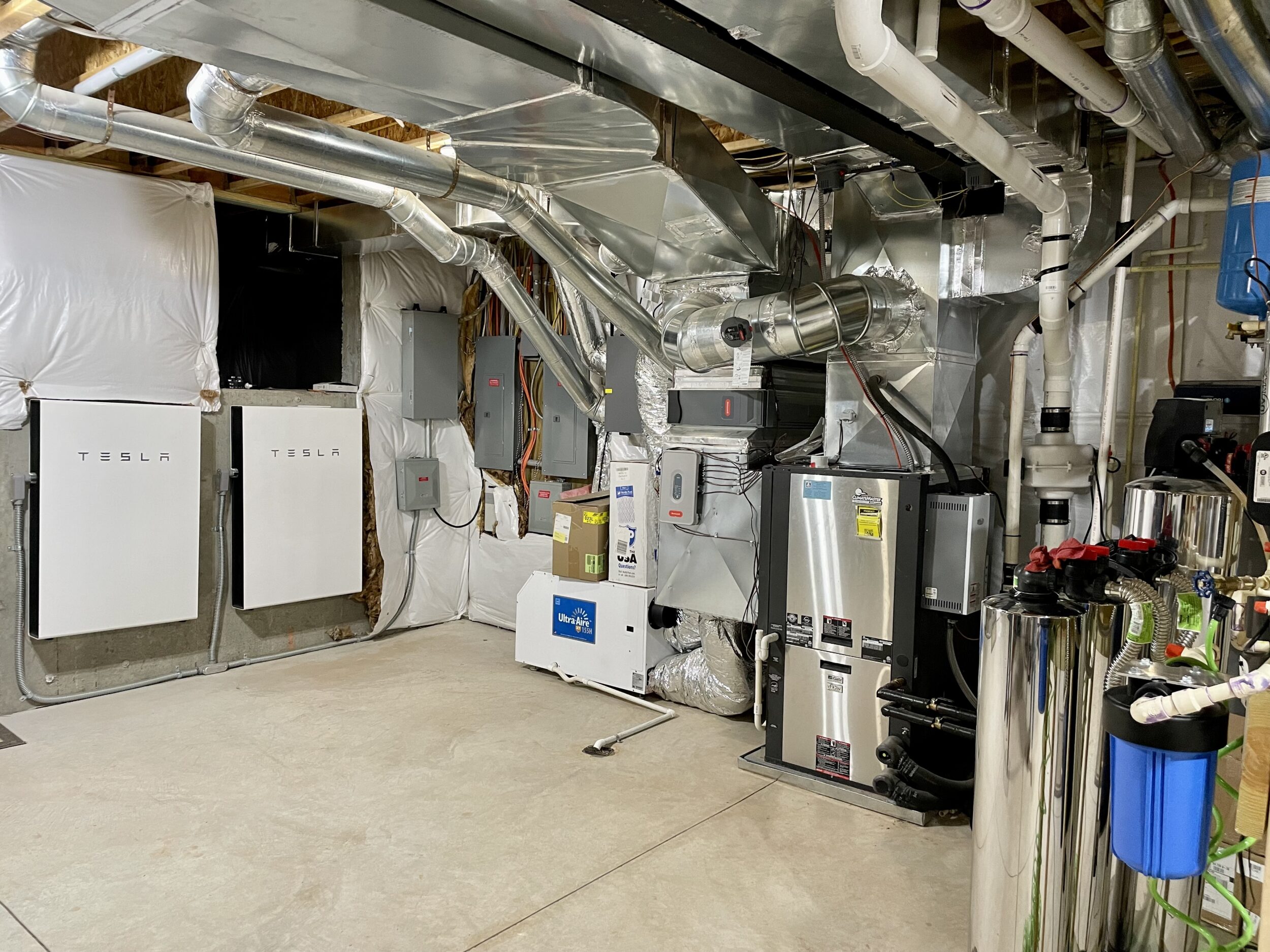 Net Zero custom home mechanical room with high-efficiency HVAC, renewable energy systems, and insulation technology in Loudoun County, Virginia