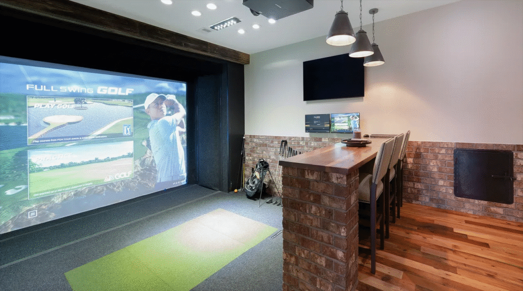 Home golf simulator room for year‑round practice in whole home renovation in Leesburg Virginia River Creek community by Alair Homes Hunt Country