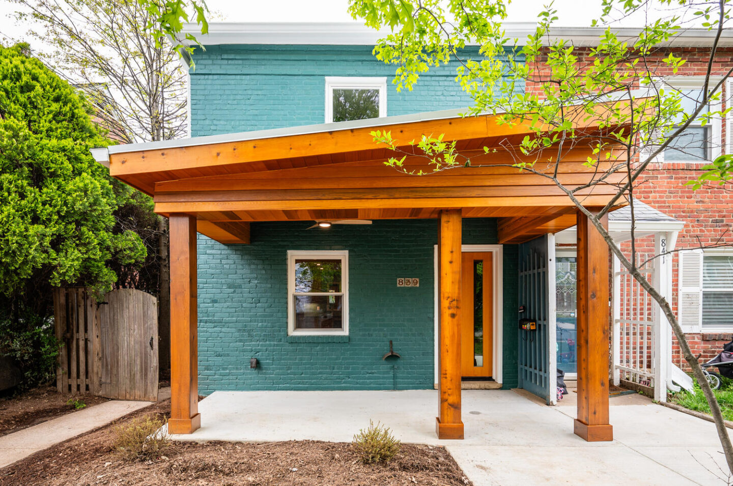 front exterior of an Arlington duplex with a wood awning