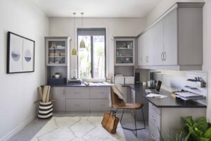 Home office with built-in cabinetry and desk for work-from-home living