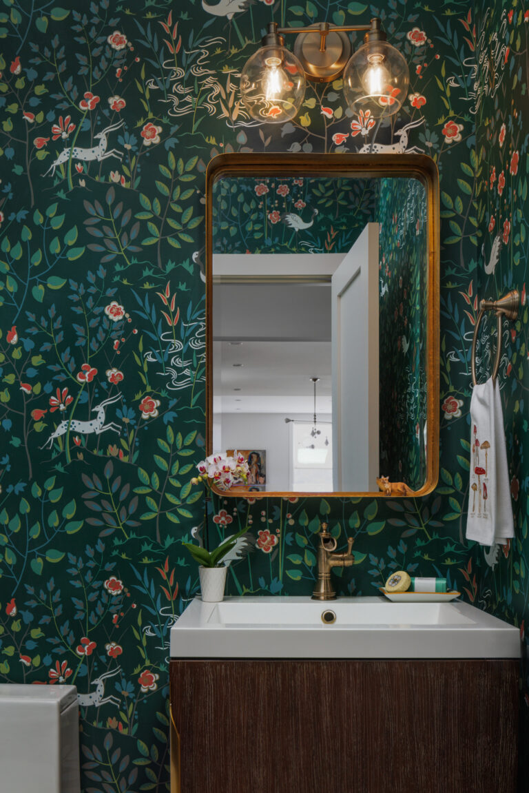 Bold pattern, warm brass, and layered texture—this powder room reflects 2026’s shift toward intimate, personality-driven spaces.