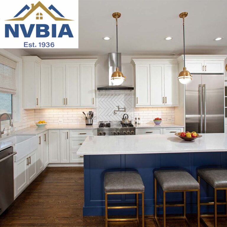 Remodeled kitchen with white cabinetry and blue island