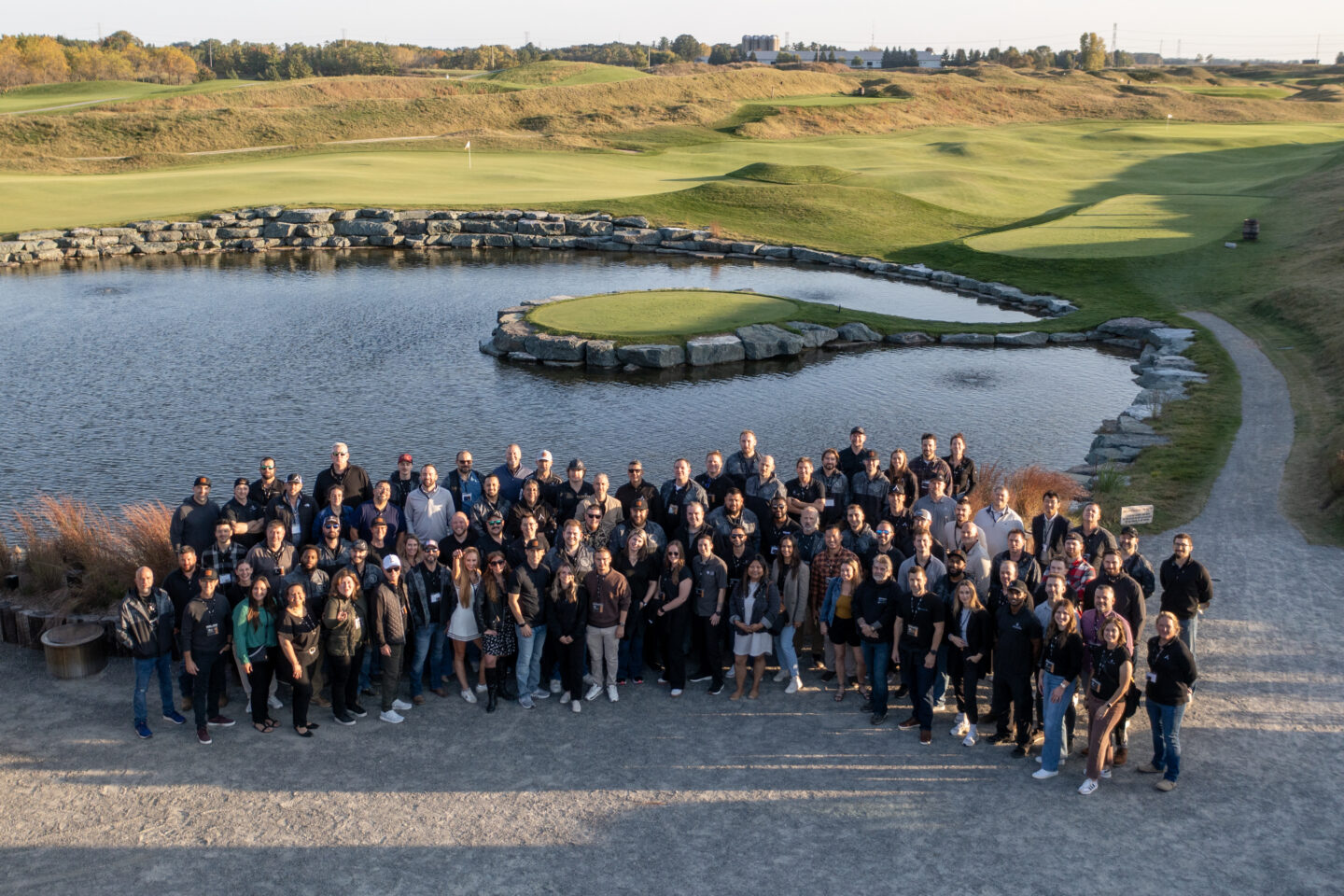 Exterior group photo of the attendees of Alair's PM Summit at the Kohler resort.