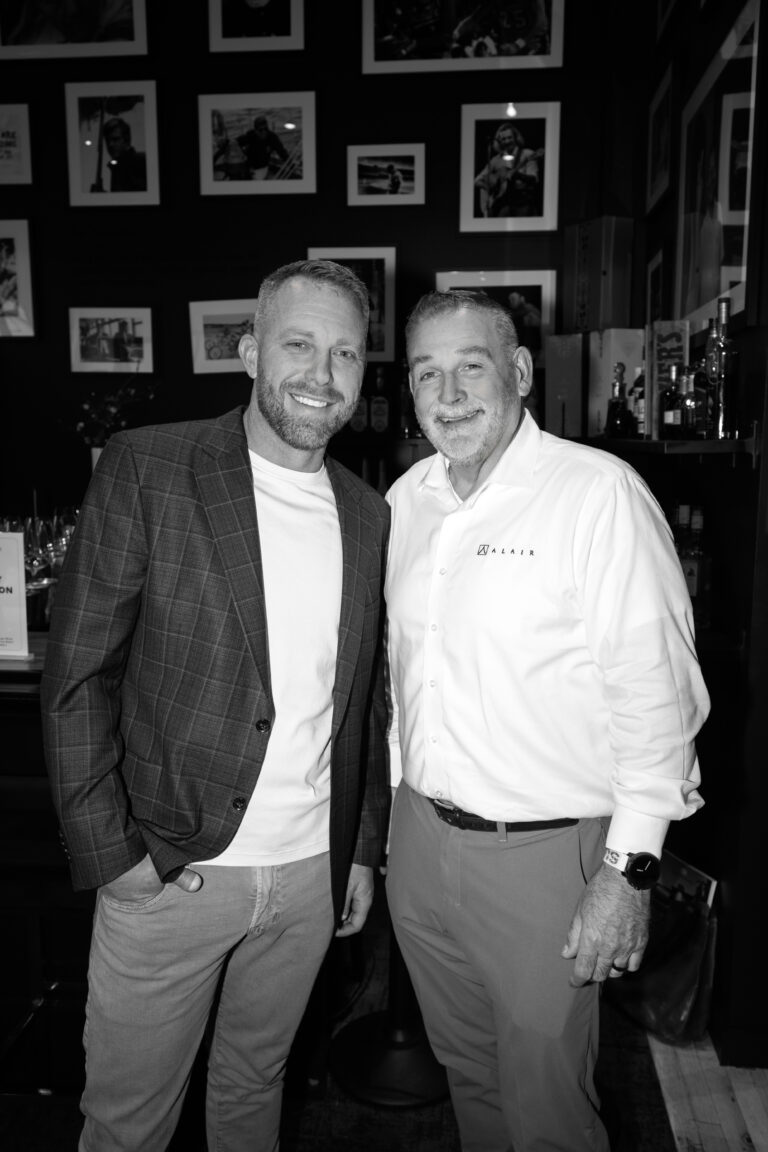 a photo of Darren, VP of operations and Stacy Eakman of Alair Homes celebrating Stacy's reginal partnership in California