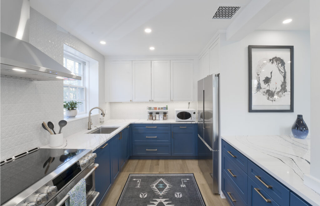 Two-toned cabinetry in a bright condo kitchen space.