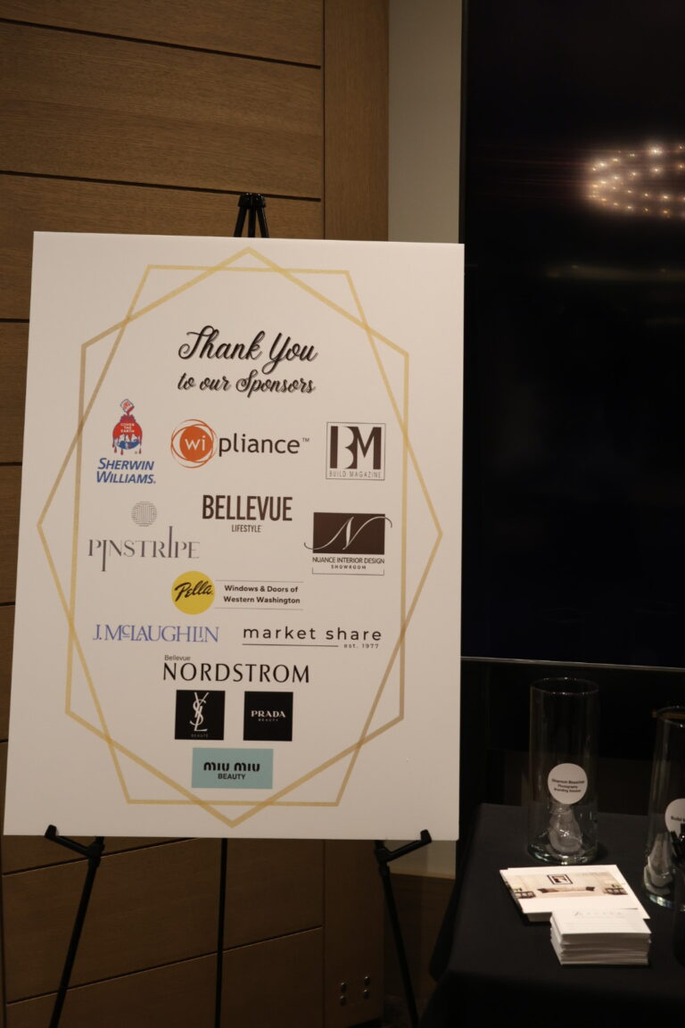 a photo of a banner of all the sponsors of Women of Influence event organized by Alair Homes Kirkland