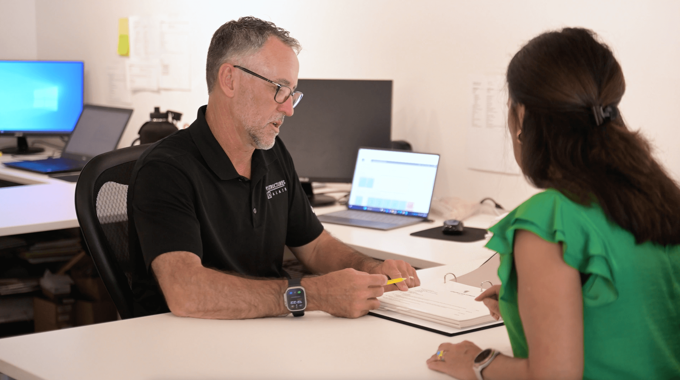Man and Women looking at paperwork