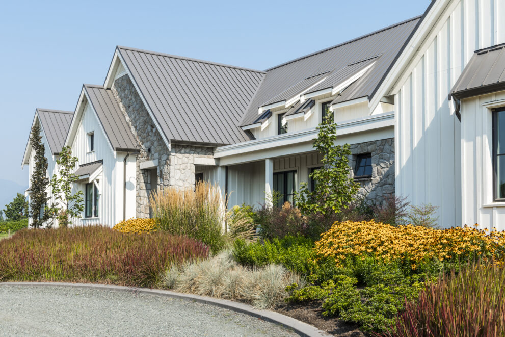 Exterior of house with a landscape featuring a variety of plants