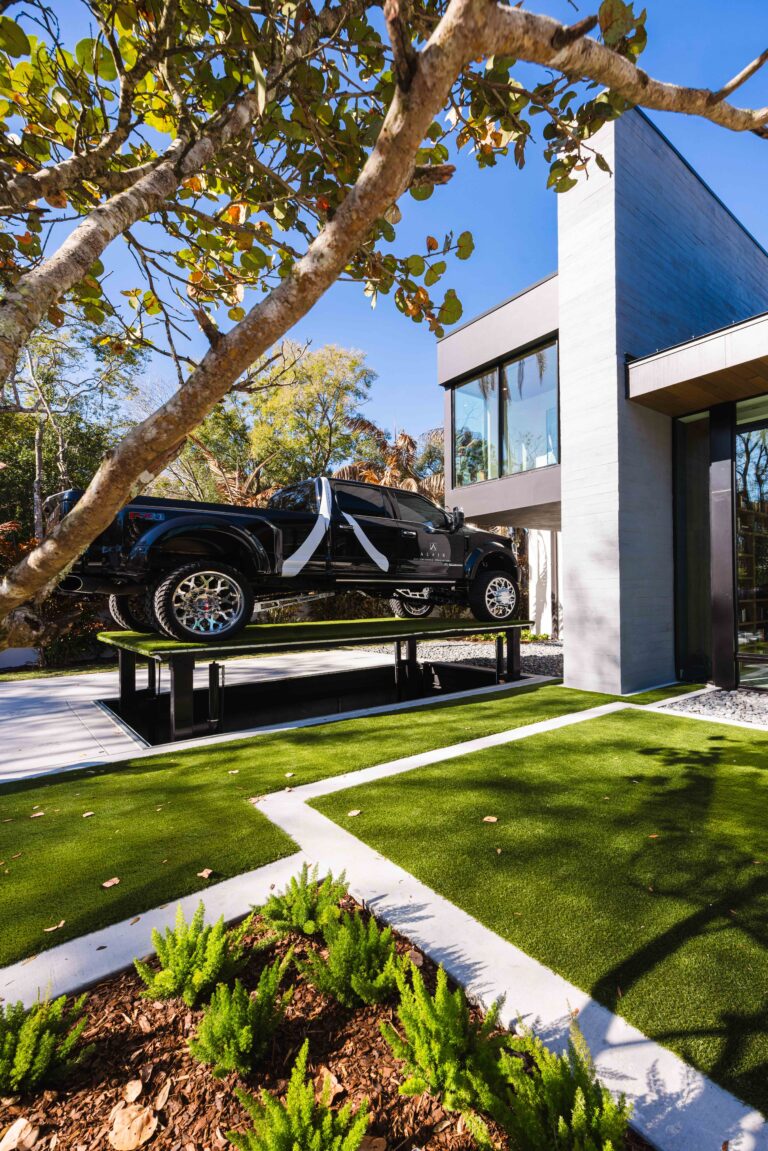 Alair truck is parked in front of The New American Home in Orlando recently completed by Alair team, the process of building this custom home is discussed on The Build Magazine podcast