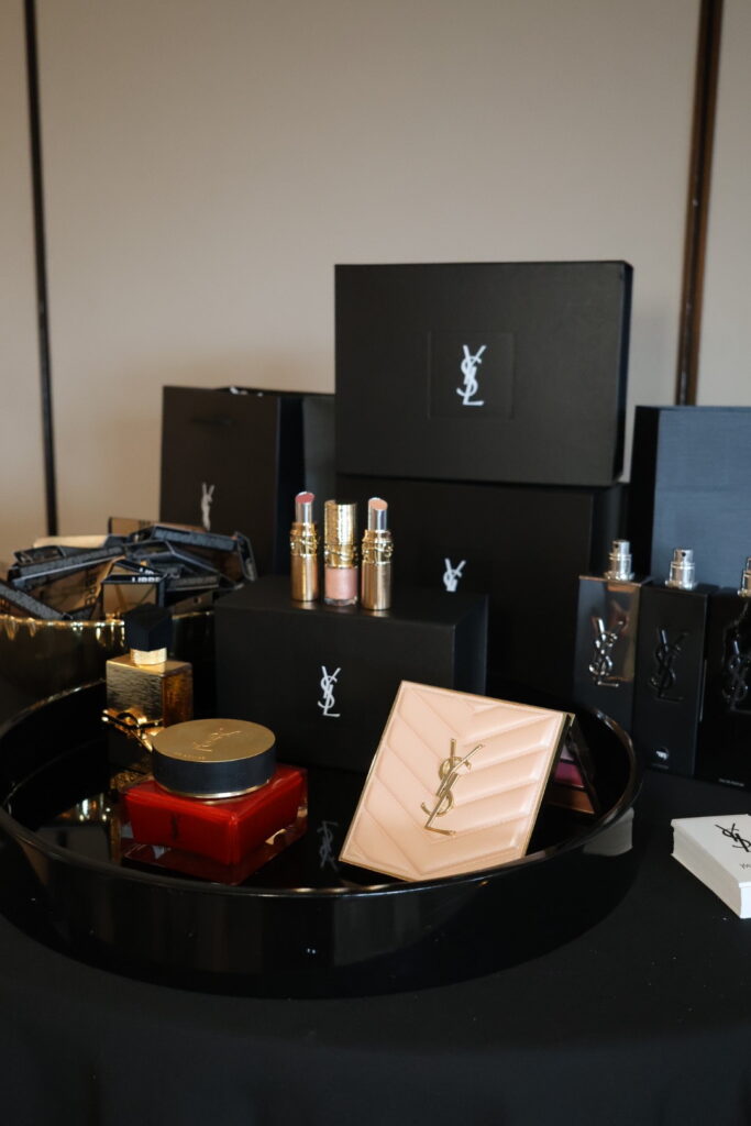 display of yves saint laurent makeup at the women of influence event at Overlake Country Club hosted by Alair Homes Kirkland