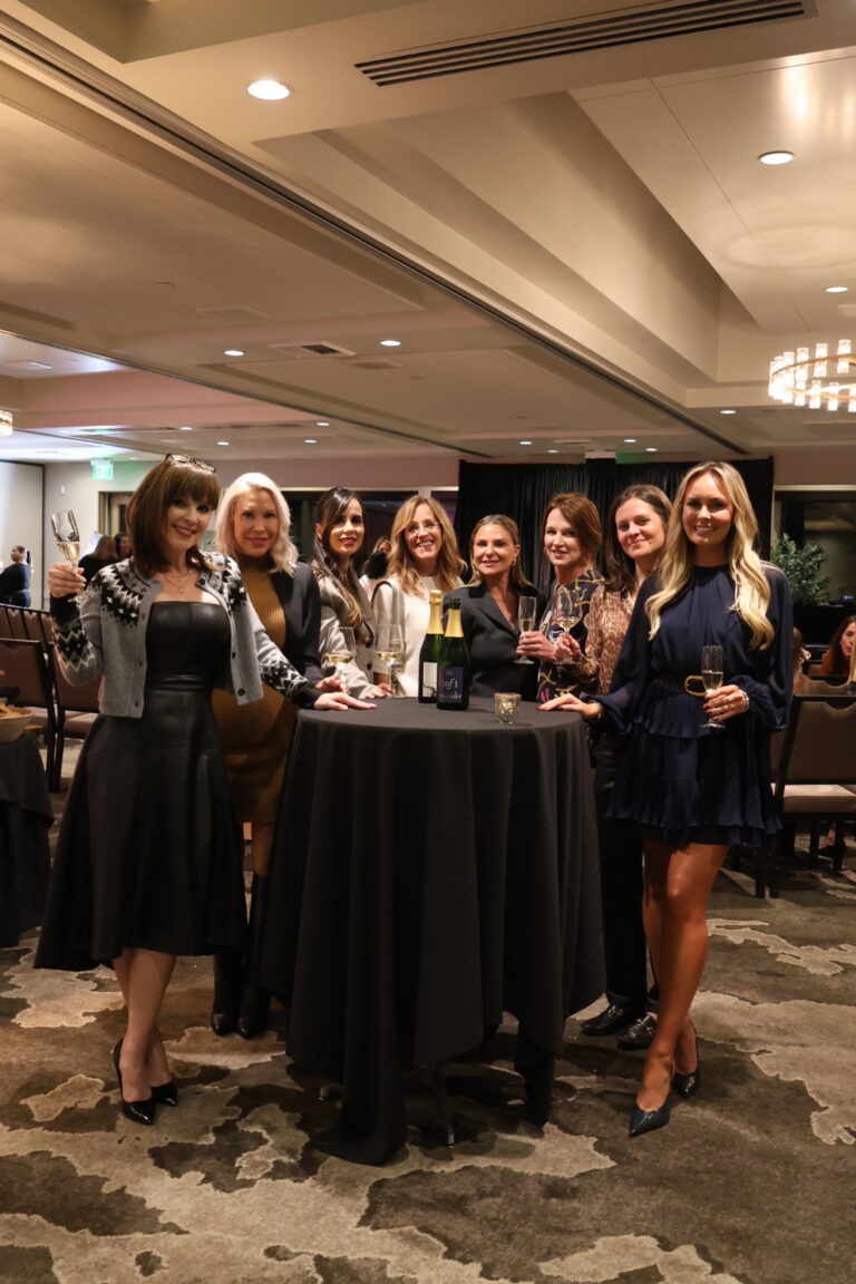Beth Gale of Alair Kirkland and a panel of women standing at the cocktail table who were invited to speak at the Women of Influence Event at Overlake Golf & Country Club in November of 2025 | hosted by Alair Homes Kirkland