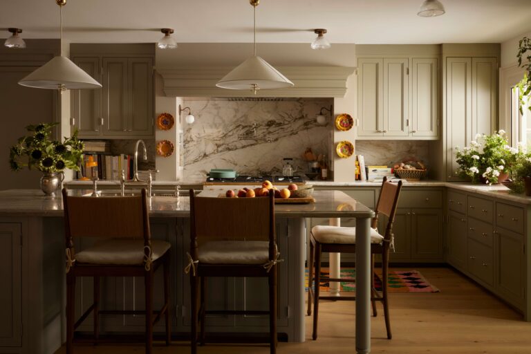 Kitchen island with pendent lighting and custom millwork.